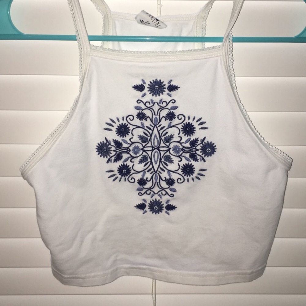 White croptop with blue design